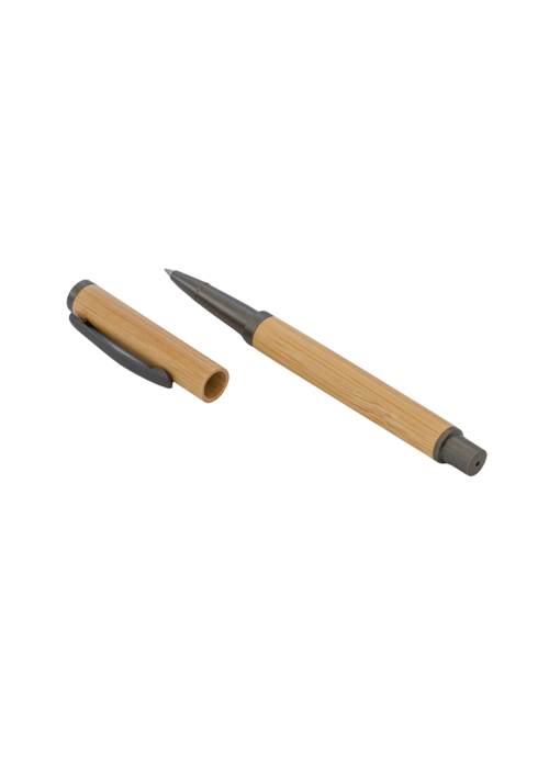 A photo of a bamboo pen with the cap detached.