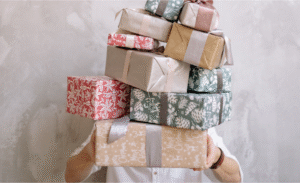 a-man-holding-a-lot-of-gifts