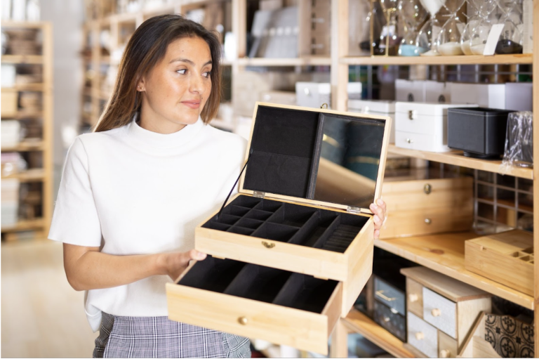 woman-holding-a-wooded-jewelry-box