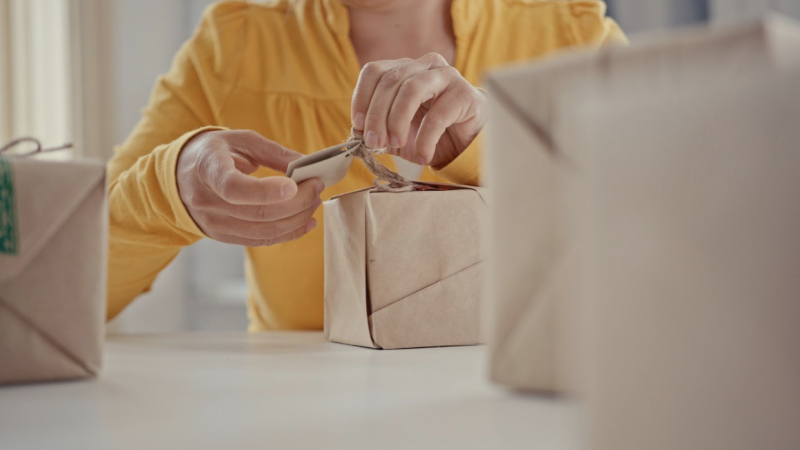 woman-with-yellow-top-gift-wrapping