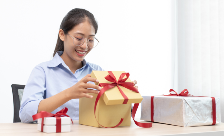 a-woman-holding-a-gift