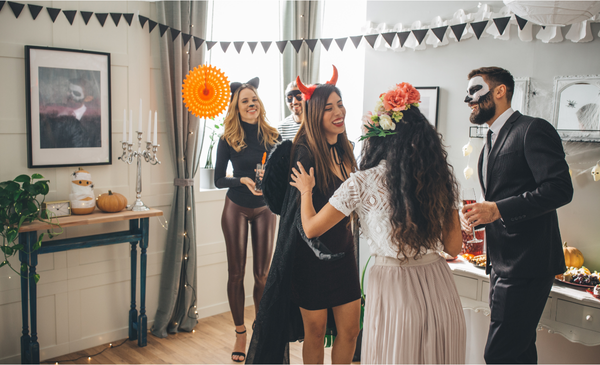 a-group-people-wearing-halloween-costumes-are-greeting-each-other