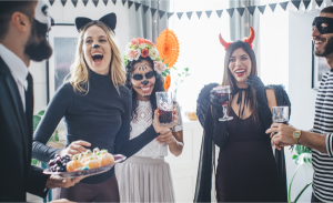 a-group-people-wearing-Halloween-costumes-are-laughing