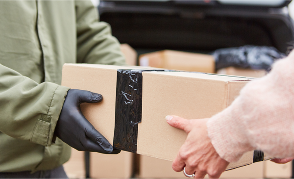 hands-carrying-a-box