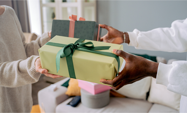 two-people-exchanging-gifts