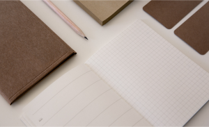 an-opened-notebook-with-pen-and-pads