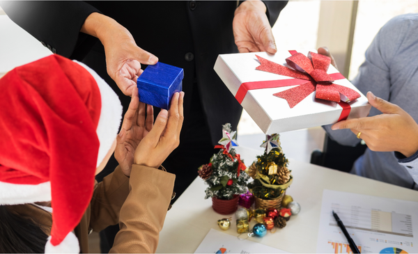 a-person-handing-out-gifts