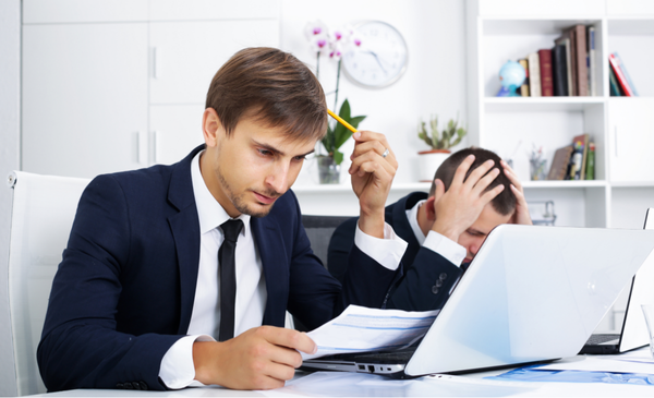 two-employees-looking-frustrated