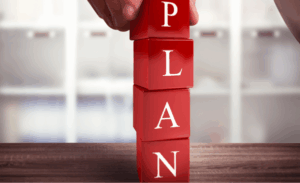 a-hand-building=letter-blocks-with-word-plan