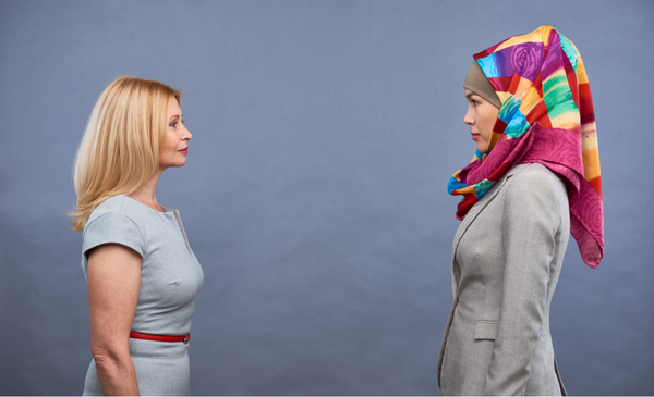 two-women-of-different-culture-facing-each-other